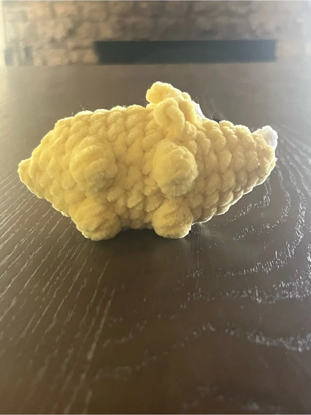 Crocheted baby triceratops dinosaur